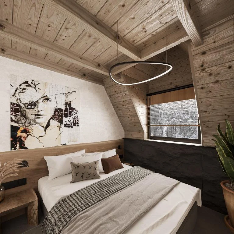 Designer bedroom with wooden A-frame ceiling and artistic wall mural